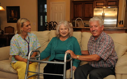 Respite Care Relief New Port Richey, FL Caregiver sitting on couch with elderly couple