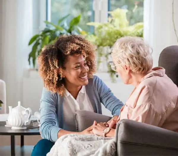 Companionship Home Care Services Caregiver talking to elderly woman